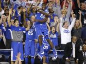 Kentucky forward Alex Poythress (22) reacts after a three-point basket during the second half of an NCAA Final Four tournament college basketball semifinal game against Wisconsin Saturday, April 5, 2014, in Arlington, Texas. Kentucky won 74-73. (AP Photo/Tony Gutierrez)