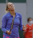 Madison Keys of the U.S. reacts after missing a shot against China's Zhang Shuai in the first round match of the French Open tennis tournament at the Roland Garros stadium in Paris, France, Monday, Sept. 28, 2020. (AP Photo/Christophe Ena)