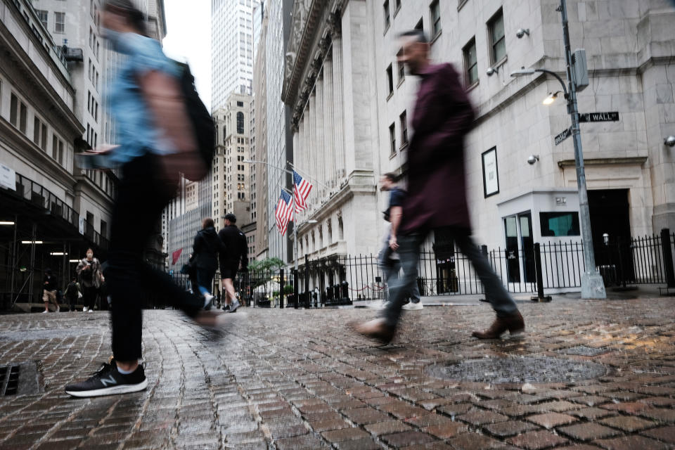 NEW YORK, NEW YORK - JUNE 16: People walk by the New York Stock Exchange (NYSE) on June 16, 2022 in New York City. Stocks fell sharply in morning trading as investors react to the Federal Reserve's largest rate hike since 1994.  (Photo by Spencer Platt/Getty Images)