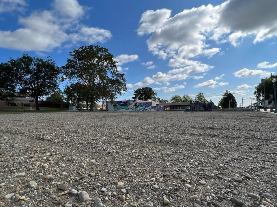 Shown is the site of a green space and pocket park project by ArtsinStark in downtown Canton. In the background is the former Ziegler Tire building, the proposed site of a permanent home for the EN-RICH-MENT Fine Arts Academy.