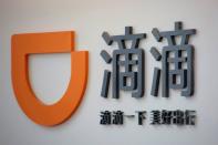 FILE PHOTO: Logo of Didi Chuxing is seen at its headquarters in Beijing