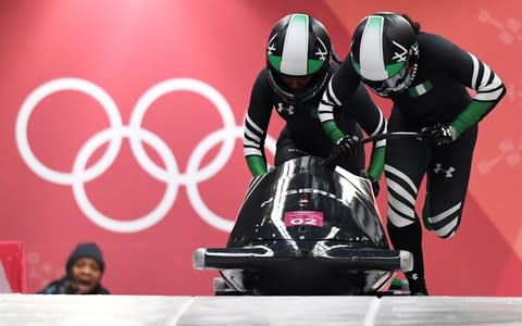 Nigeria's Moriam Seun Adigun (right) and Nigeria's Akuoma Omeoga make history but finish dead last  - Credit: MARK RALSTON/AFP/Getty Images