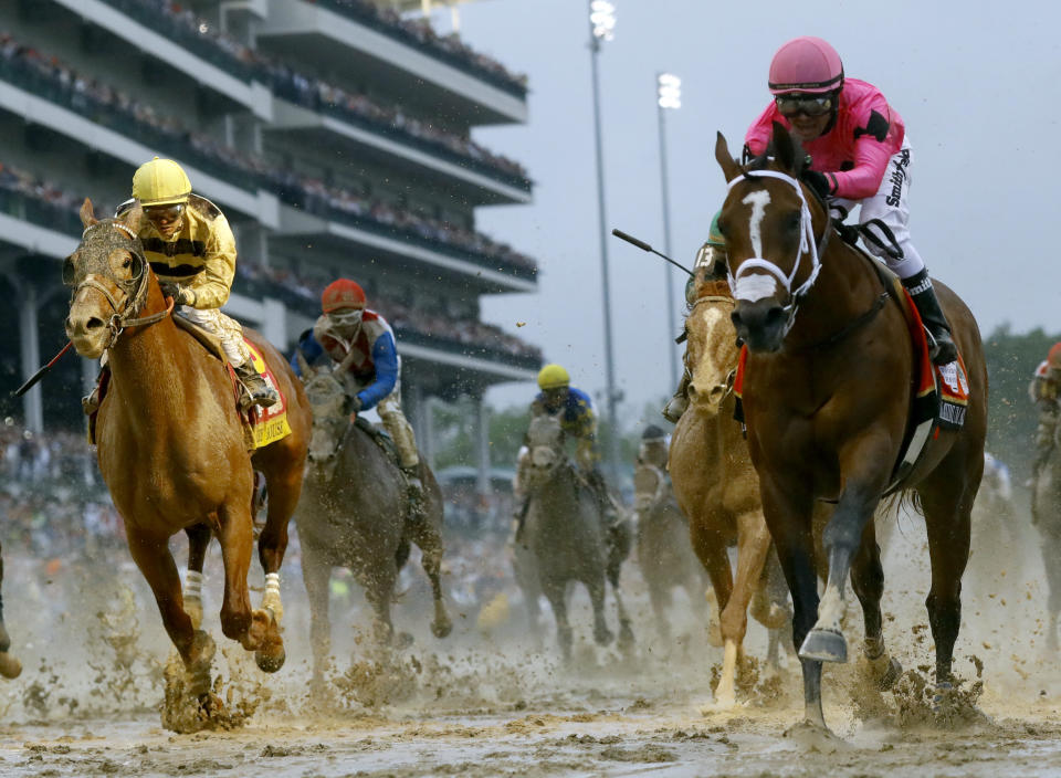 Luis Saez rides Maximum Security, right, across the finish line first against Flavien Prat on Country House during the 145th running of the Kentucky Derby horse race at Churchill Downs Saturday, May 4, 2019, in Louisville, Ky. Country House was declared the winner after Maximum Security was disqualified following a review by race stewards. (AP Photo/Matt Slocum)