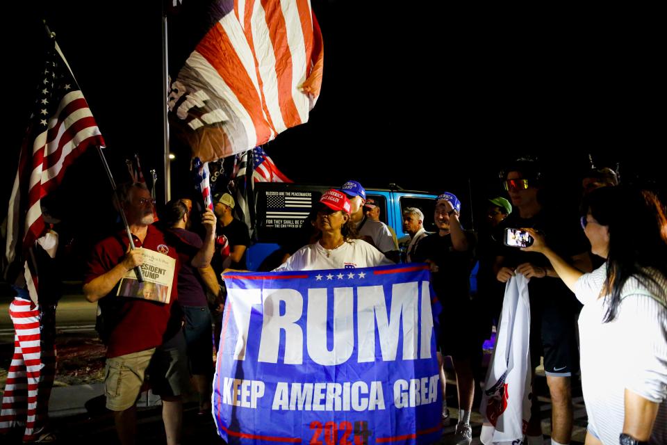 Supporters of former President Donald Trump rally near his home at Mar-a-Lago resort on Aug. 8, 2022, in Palm Beach, Fla.