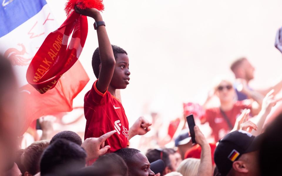  Fans 0f Liverpool FC celebrate at the Liverpool fan zone at Cours de Vincennes - Boris Streubel/UEFA via Getty Images