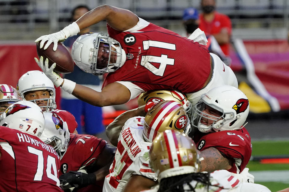 Arizona Cardinals running back Kenyan Drake (41) dives over the line for a touchdown against the San Francisco 49ers during the second half of an NFL football game, Saturday, Dec. 26, 2020, in Glendale, Ariz. (AP Photo/Rick Scuteri)