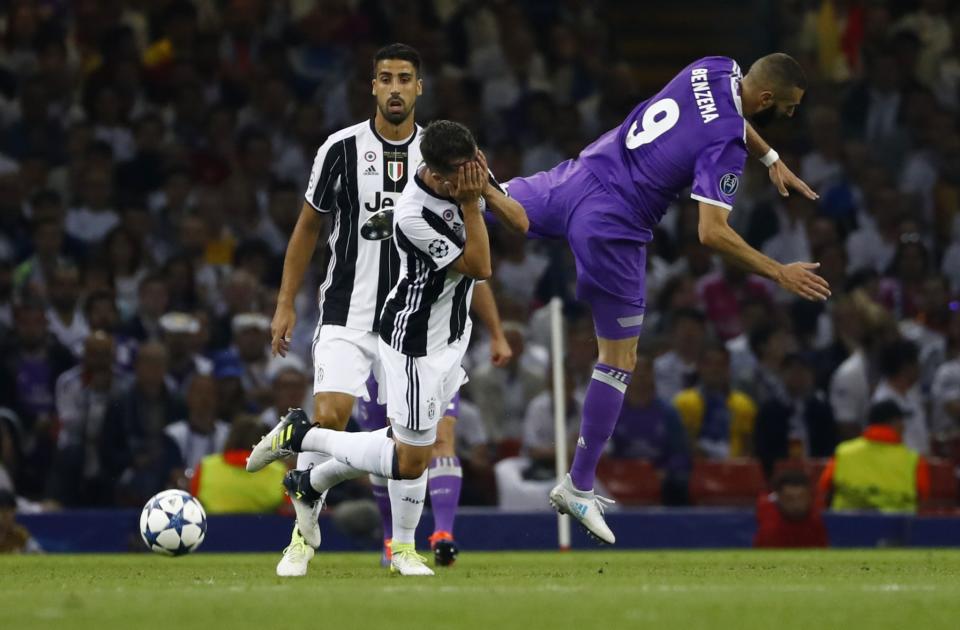 <p>Real Madrid’s Karim Benzema in action with Juventus’ Miralem Pjanic </p>