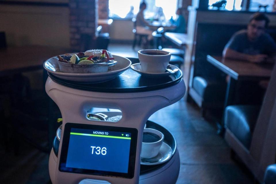 ASTRO, a robot server at Sergio’s restaurant in Kendall, heads to table T36 loaded with the order.