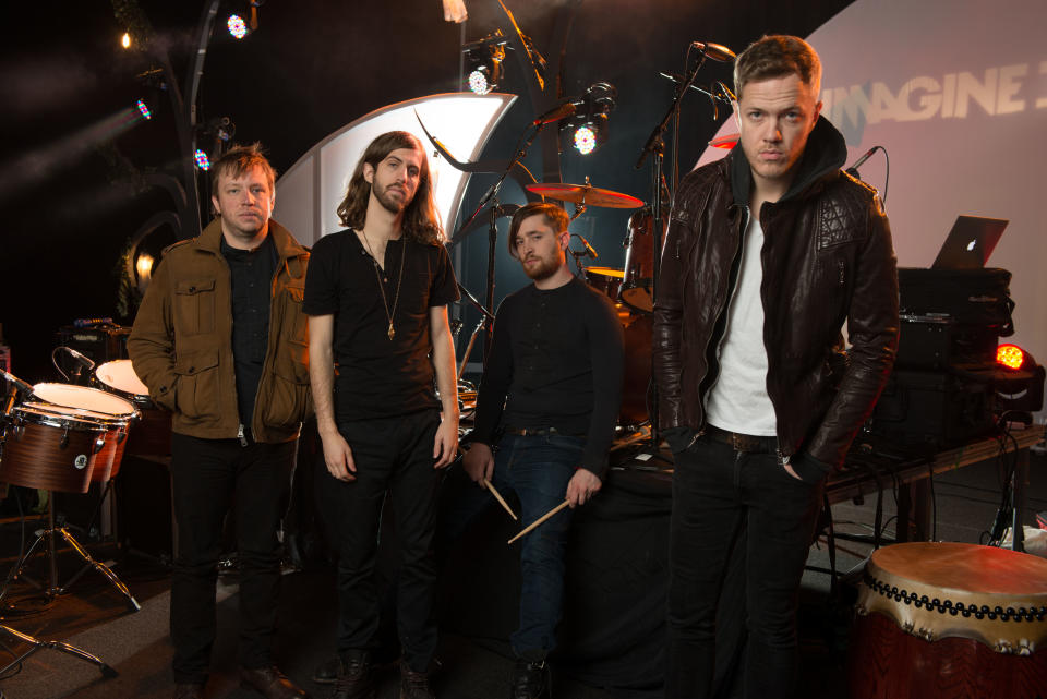 In this Feb. 6, 2013 photo, Las Vegas-based rock band Imagine Dragons, from left, Ben McKee, Wayne Sermon, Dan Platzman and Dan Reynolds pose for a group portrait in Las Vegas. The band's debut album “Night Visions,” has reached gold status and features the hits “It’s Time” and “Radioactive.” The foursome, signed to music producer Alex da Kid’s label imprint, is currently on a U.S. tour. (Photo by Al Powers/ Powers Imagery/Invision/AP)