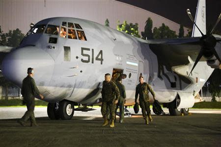 U.S. Marines with the 3rd Marine Expeditionary Brigade, III Marine Expeditionary Force, arrive at Villamor Air Base, Philippines in this handout photo taken November 10 and released to Reuters on November 13, 2013. REUTERS/Capt. Josh Diddams/U.S. Marine Corps/Handout via Reuters