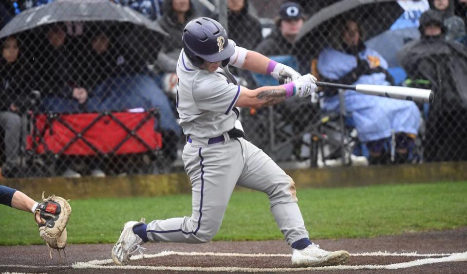 Puyallup Kai Halstead connects for his second home run of the game - a three-run homer in the fifth inning to put the Vikings up 4-2 during Wednesday afternoon’s baseball game against the Olympia Bears at Olympia High School in Olympia, Washington, on April 12, 2023. Halstead went 3-3 with two home runs and four RBIs in Puyallup’s 6-2 victory.