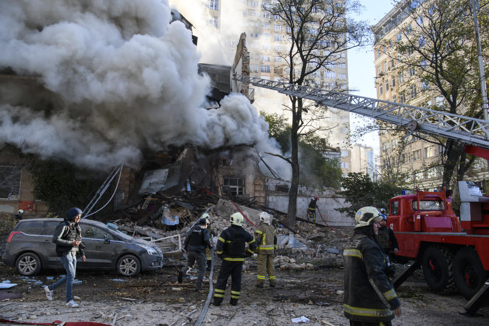 Ukrainian rescuers work at the scene of a drone attack in downtown Kyiv, Ukraine, October 17,  2022 (Photo by Maxym Marusenko/NurPhoto via Getty Images)