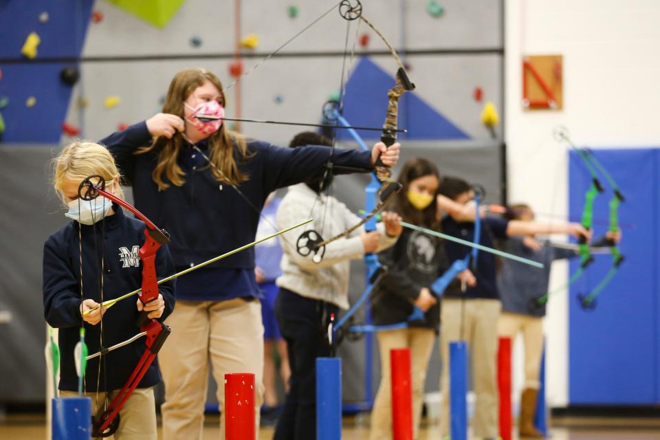 Lower-division students had an archery contest during their pep rally as part of the annual Thanksgiving celebration and community service day at Marburn Academy in New Albany.