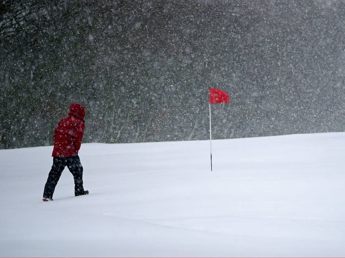 Snow falls at the Saddleworth Moor golf course in Uppermill near Oldham (PA)