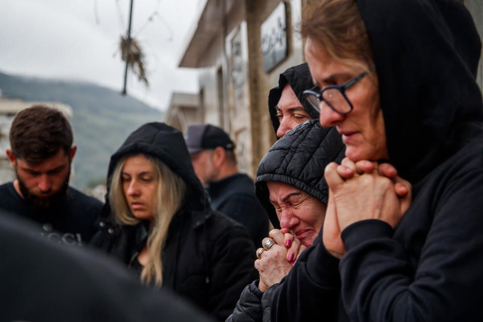 People mourn during the burial of a victim in Mucum, Rio Grande do Sul, Brazil, on Sept. 9, 2023. (Claudia Martini / Xinhua News Agency via Getty Images)