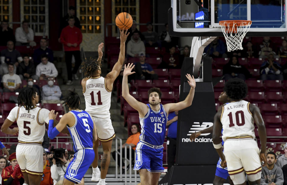 Boston College's Makai Ashton-Langford (11) takes an outside shot against Duke's during the first half of an NCAA college basketball game, Saturday, Jan. 7, 2023, in Boston. (AP Photo/Mark Stockwell)