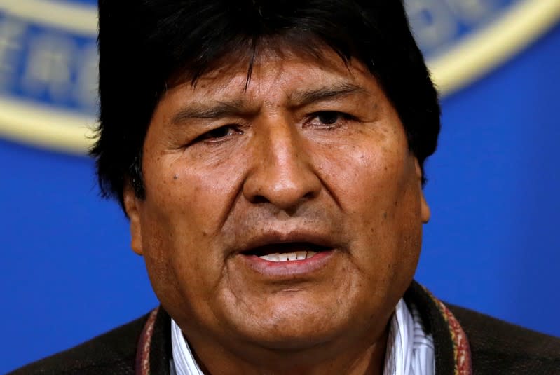 Bolivia's President Evo Morales addresses the media at the presidential hangar in the Bolivian Air Force terminal in El Alto