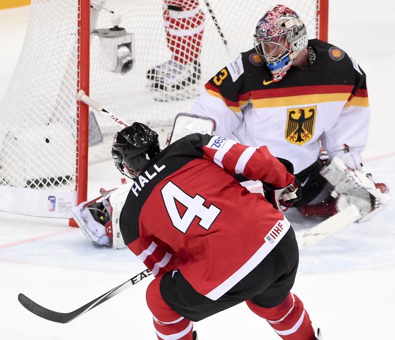 Canada forward Taylor Hall shoots to score past goalkeeper Danny aus den Birken of Germany during their match in the IIHF International Ice Hockey World Championship on May 3, 2015 in Prague