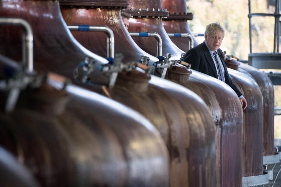 Prime Minister Boris Johnson amongst the whisky stills at the Roseisle Distillery in Scotland near Moray (Stefan Rousseau/PA) (PA Archive)