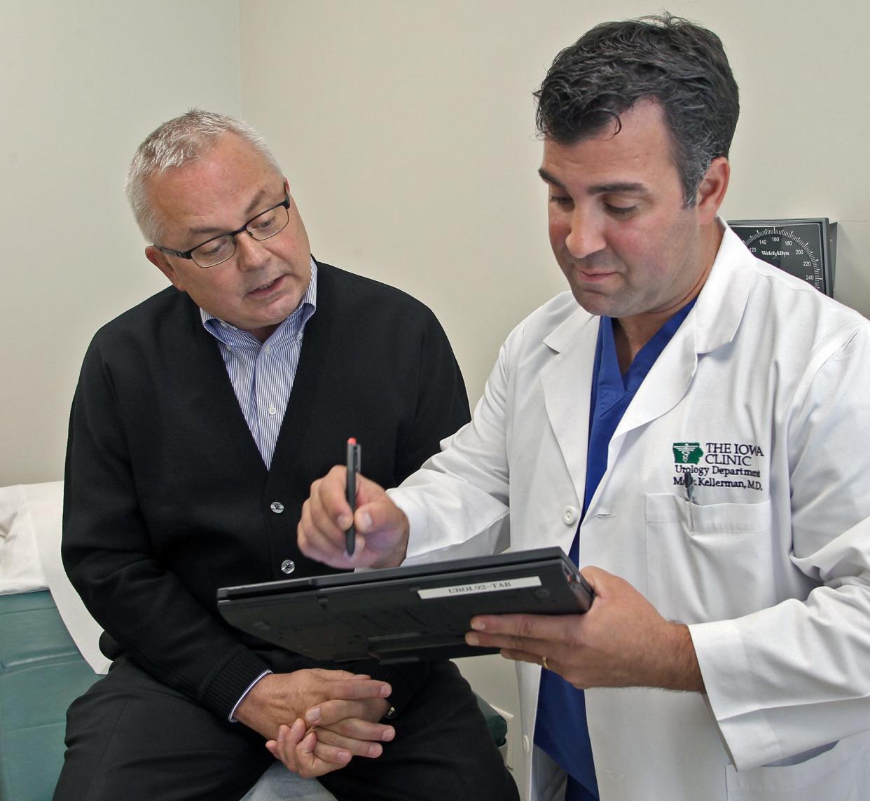 Iowa Clinic urologist Mark Kellerman, right, consults with prostate-cancer patient Jim Turner in 2012.  Kellerman is one of three Iowa Clinic urologists fired in September 2018 amid a dispute with the specialty practice.