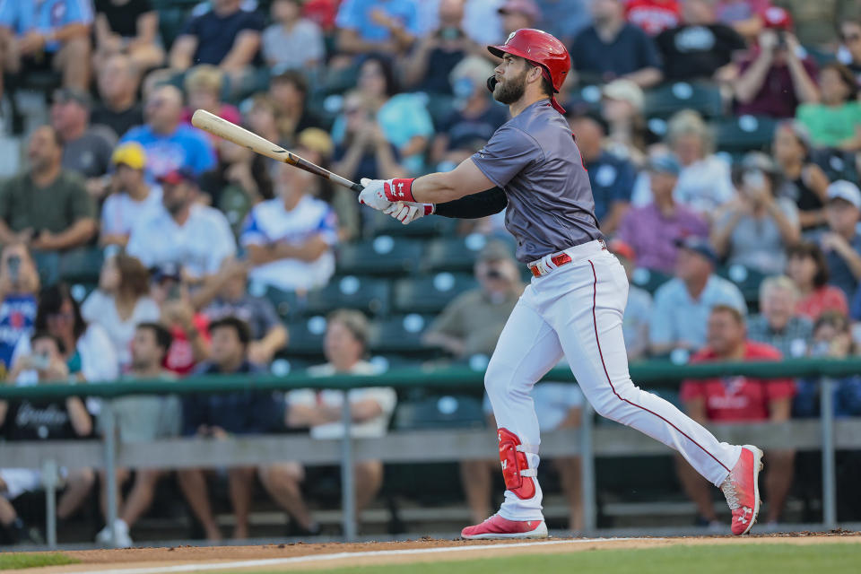 Bryce Harper watches his solo homer against the Gwinnett Stripers in the first inning of a Triple-A baseball game while he begins his rebab assignment at Lehigh Valley Iron Pigs in Allentown, Pa., Tuesday, Aug. 23, 2022. (Steven M. Falk/The Philadelphia Inquirer via AP)