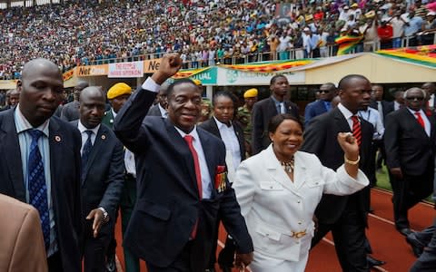 Emmerson Mnangagwa and his wife Auxillia arrive at the presidential inauguration ceremony in the capital Harare, Zimbabwe - Credit: AP