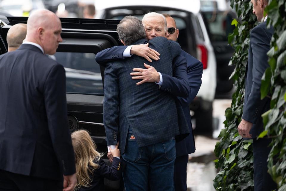 US President Joe Biden hugs his son Hunter Biden as they leave The Ivy restaurant in Los Angeles, California, February 4, 2024 (AFP via Getty Images)