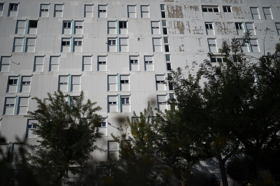 A tower block in pictured from the shared vegetable garden at the Cite de Frais Vallon in Marseille, southern France, Monday, Oct. 25, 2021. Urban gardens are sprouting hope in drug- and violence-plagued neighborhoods of Marseille. From publicly funded city-wide initiatives to residents taking it upon themselves to start cultivating the land around them, urban farming is changing the landscape and creating a space for community. (AP Photo/Daniel Cole)