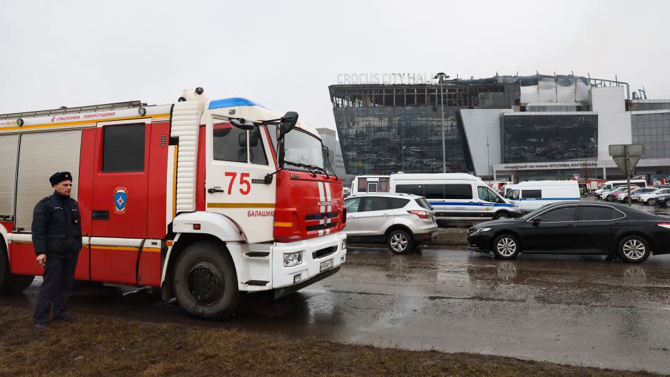 Emergency services personnel and police work at the scene of the gun attack at the Crocus City Hall concert hall in Krasnogorsk on March 23. - Stringer/AFP/Getty Images