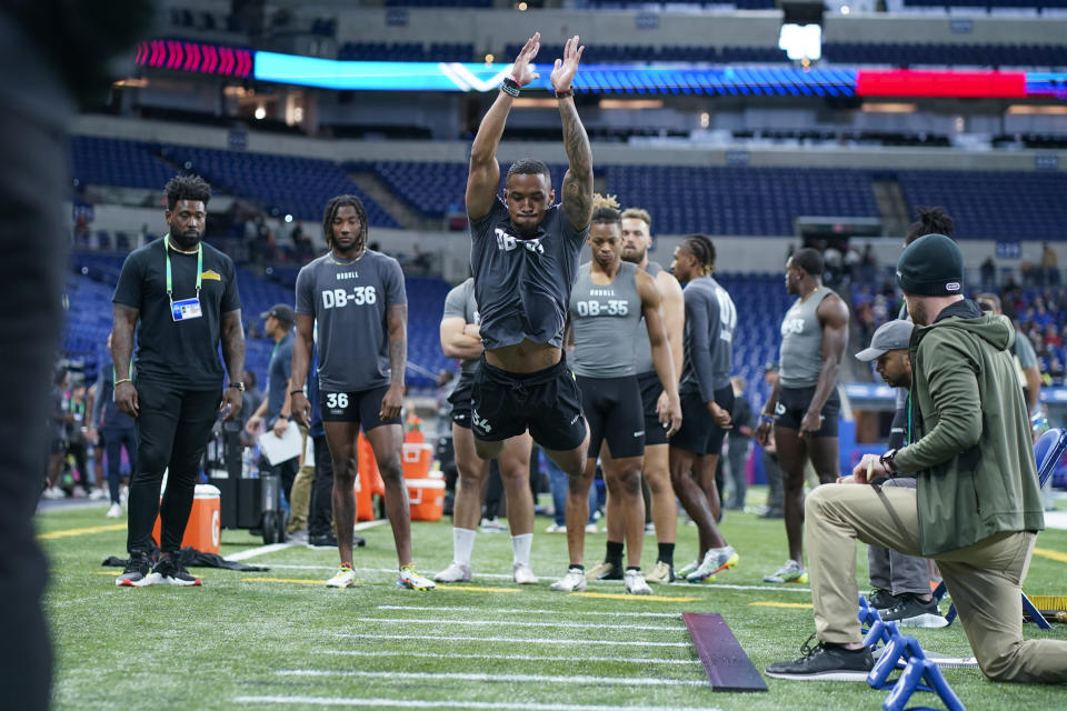 Michigan defensive back DJ Turner II runs a drill at the NFL football scouting combine in Indianapolis, Friday, March 3, 2023. (AP Photo/Darron Cummings)