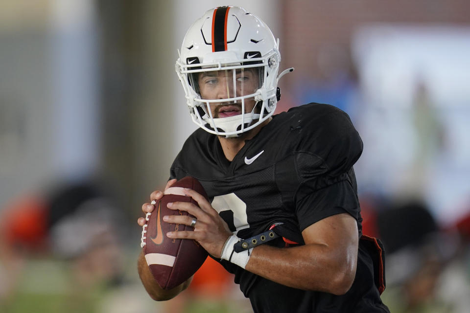 FILE - Oklahoma State's Spencer Sanders during an NCAA college football practice, Friday, Aug. 5, 2022, in Stillwater, Okla. The Big 12 is going into its 12th and final season as a 10-team conference. (AP Photo/Sue Ogrocki, File)