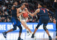 <p>Quinndary Weatherspoon #11 of the Mississippi State Bulldogs drives through Caleb Homesley #1 and Lovell Cabbil Jr. #3 of the Liberty Flames in the first round of the 2019 NCAA Men’s Basketball Tournament held at SAP Center on March 22, 2019 in San Jose, California. (Photo by Justin Tafoya/NCAA Photos via Getty Images) </p>