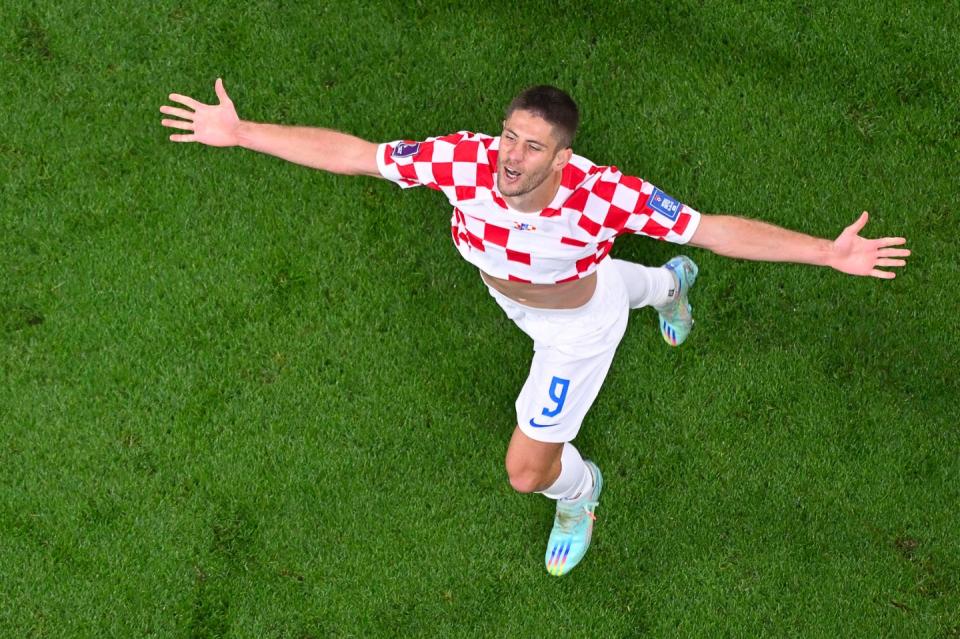 Croatia's forward #09 Andrej Kramaric celebrates scoring his team's third goal during the Qatar 2022 World Cup Group F football match between Croatia and Canada at the Khalifa International Stadium in Doha on November 27, 2022. (Photo by ANTONIN THUILLIER/AFP via Getty Images)