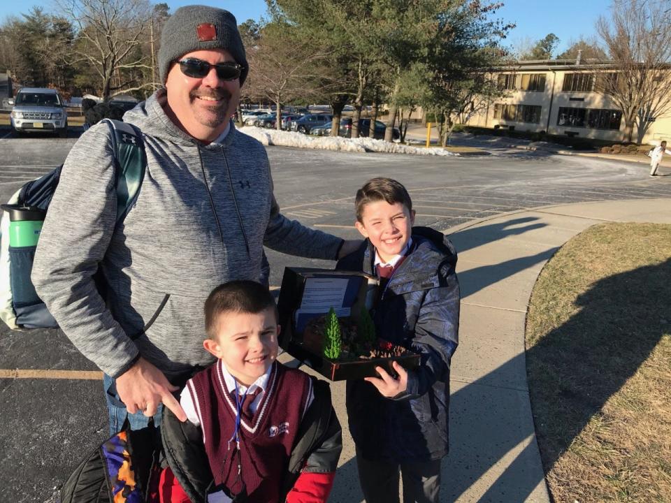 Matthew Callahan of Howell with his sons, Jack, 9, and Sean, 6, outside Mother Seton Academy in Howell. They oppose its planned closure and say parents were blindsided by a recent announcement.