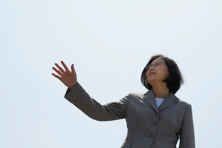 Taiwanese President Tsai Ing-wen waves her hand as she boards the nation's first domestically built 500-ton Tuo Jiang twin-hull stealth missile corvette at Suao Naval Base in Yilan, Taiwan June 4, 2016. REUTERS/Tyrone Siu
