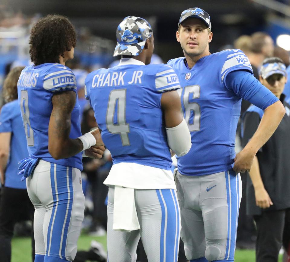 (From left) Lions wide receivers Josh Reynolds and DJ Chark and quarterback Jared Goff talk on the sidelines during the second half of the Lions' 27-23 preseason loss to the Falcons on Friday, Aug. 12, 2022 at Ford Field.