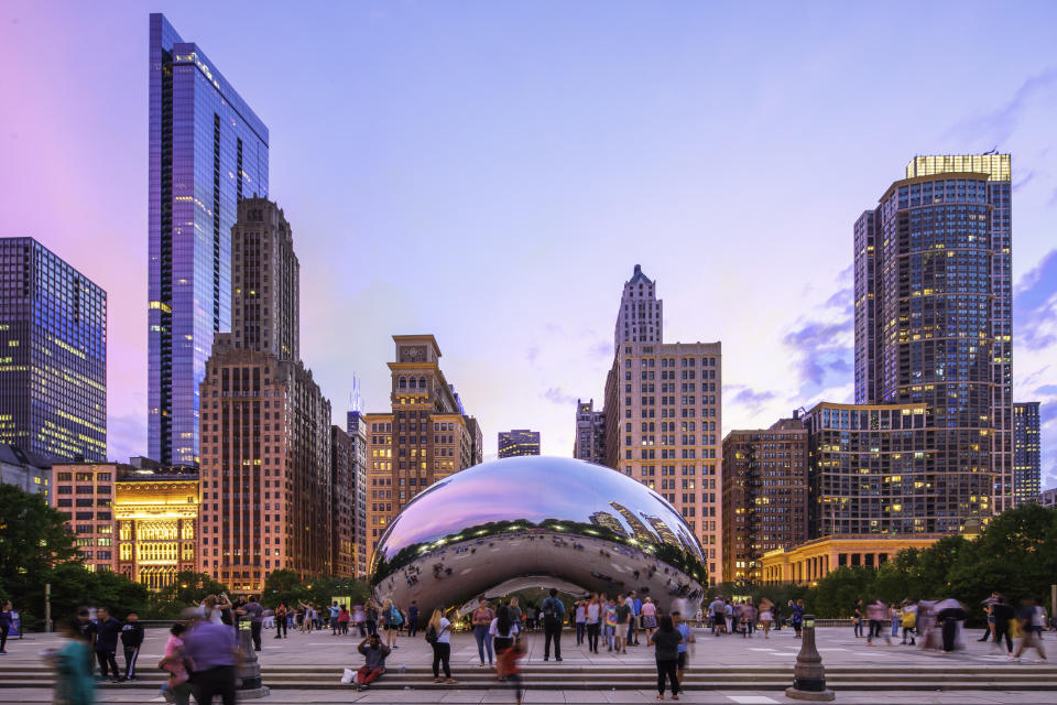 August 16, 2019 - Chicago, USA - Cloud Gate also Called "The Bean", in a summer night with tourists visiting the city