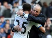 Newcastle United manager Rafa Benitez (R) embraces Andros Townsend (L) after the final whistle in the English Premier League match vs Crystal Palace at St James' Park on April 30, 2016