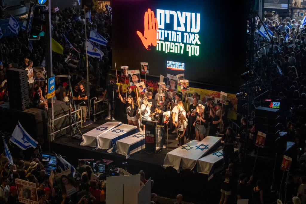 Six symbolic coffins rest on a stage during protests in Tel Aviv on Sept. 1, 2024.<span class="copyright">David Silverman—Getty Images</span>