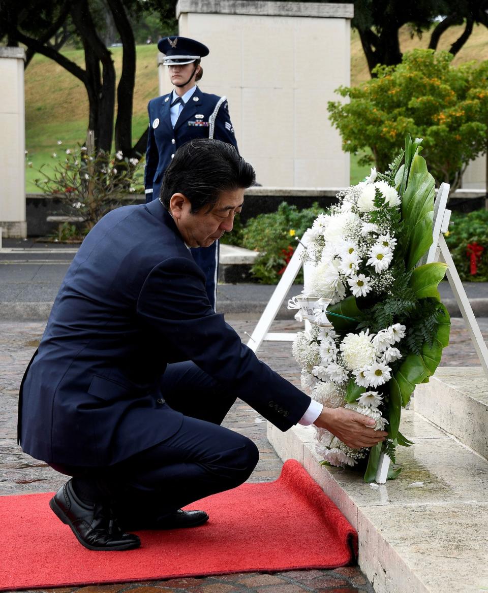 Japan’s Prime Minister Abe visits Pearl Harbor memorial on Hawaii trip