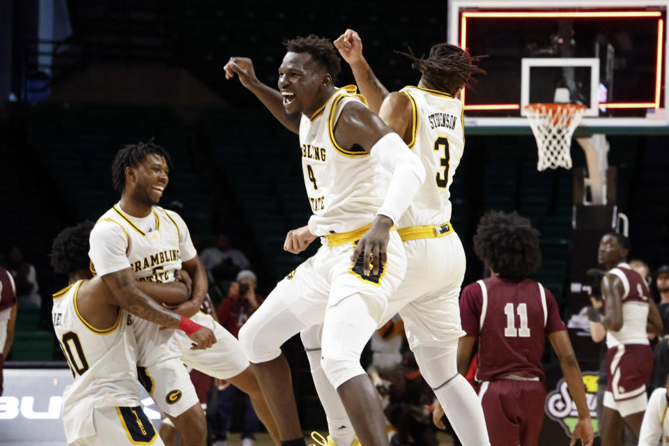 Grambling State forward Antwan Burnett (4) and guard Mikale Stevenson (3) celebrate after beating Texas Southern during the second half of an NCAA college basketball game in the championship of the Southwestern Athletic Conference tournament, Saturday, March 16, 2024, in Birmingham, Ala. (AP Photo/ Butch Dill)