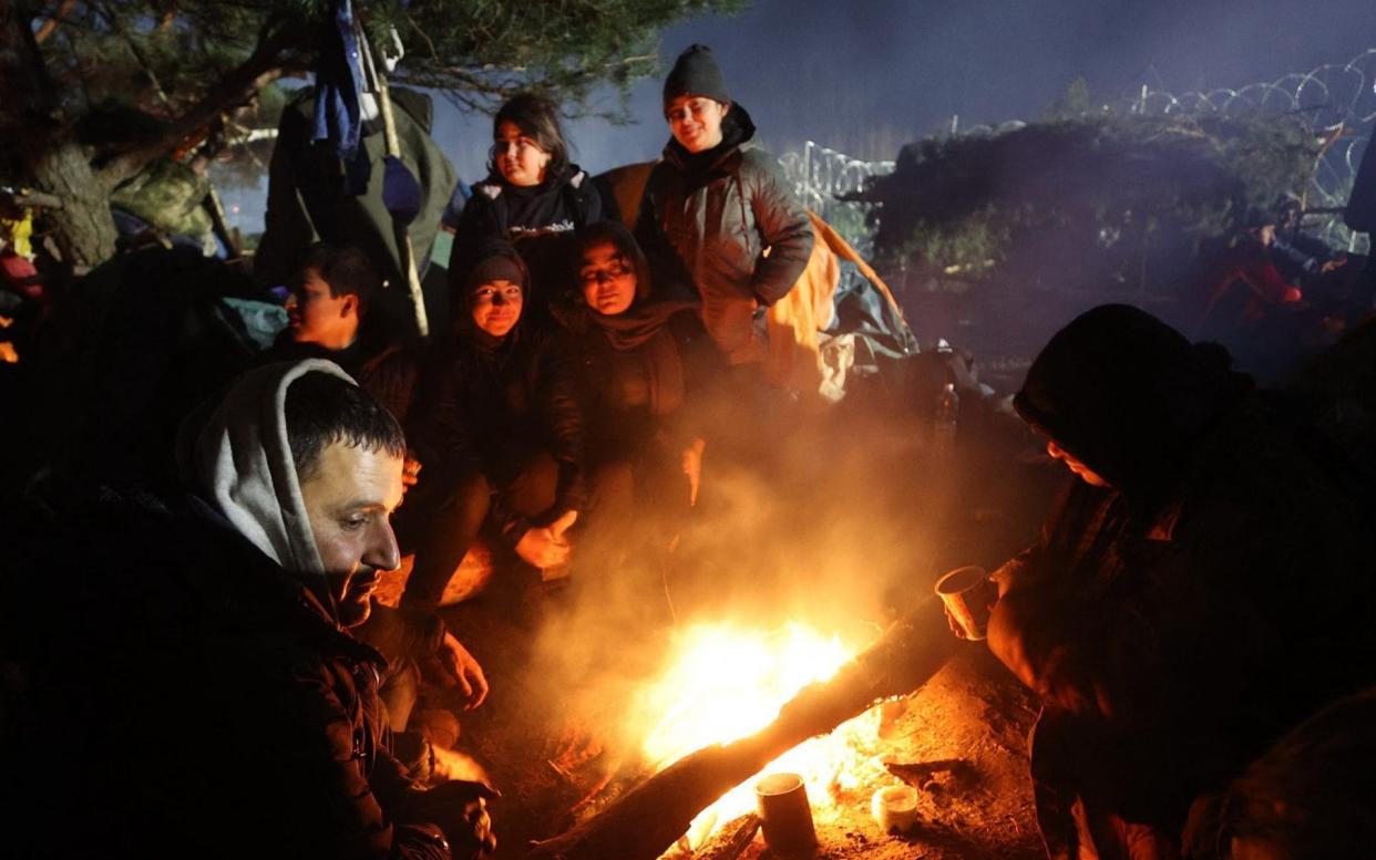 Migrants on the Belarus border with Poland. Belarus is accused of an attempt, backed by Vladimir Putin, to wage a 'hybrid war' in Eastern Europe