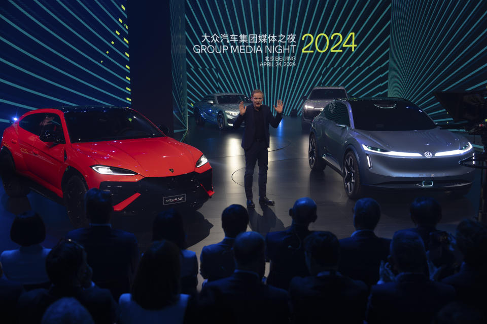 Volkswagen CEO Oliver Blume speaks during a media event held by the Volkswagen Group a day before the auto show in Beijing, Wednesday, April 24, 2024. The Volkswagen Group, which includes Audi and Porsche, plans to launch 40 new models in China over the next three years and to have a lineup of 30 EVs by 2030. (AP Photo/Ng Han Guan)