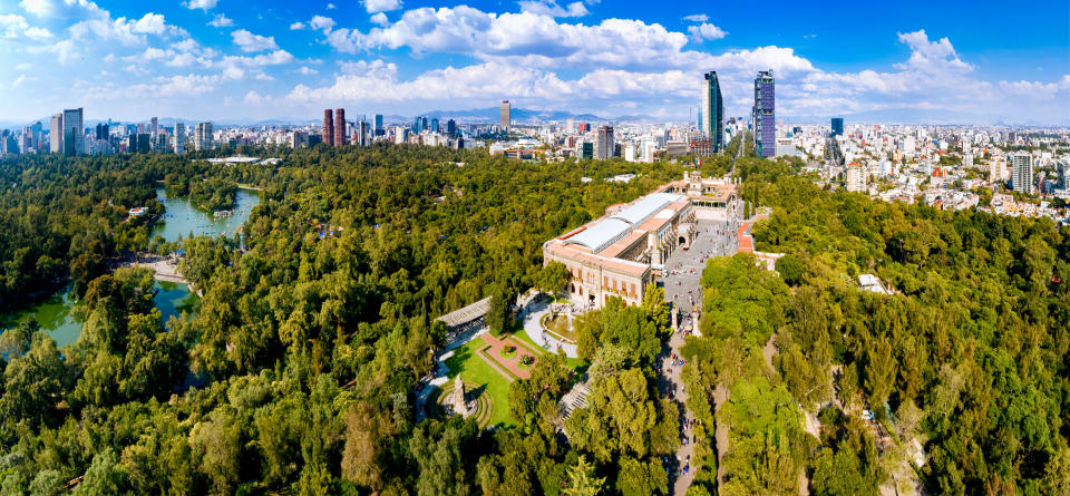 Panoramic aerial view of Chapultepec Castle with Mexico City skyline on the background