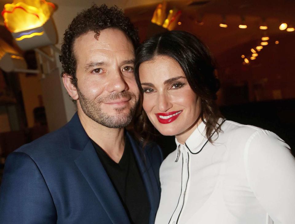 Aaron Lohr and wife Idina Menzel pose at The Opening Night After Party for The Roundabout Theatre Company's new play "Skintight" at Naples 45 Restaurant on June 21, 2018 in New York City