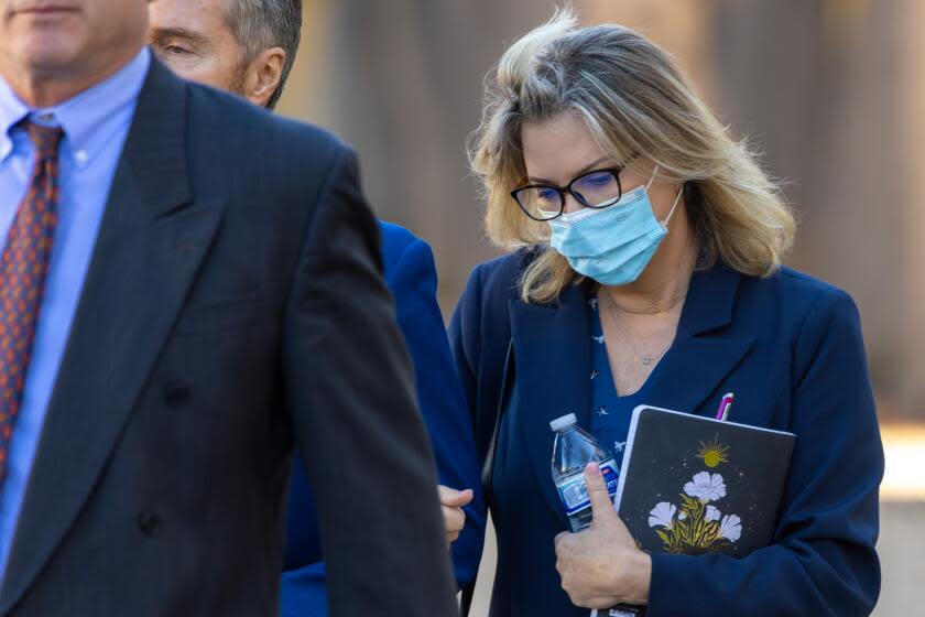 VAN NUYS, CA - JANUARY 23: Rebecca Grossman, right, holding her husband Peter Grossman exits Van Nuys Courthouse West on Tuesday, Jan. 23, 2024 in Van Nuys, CA. (Irfan Khan / Los Angeles Times)