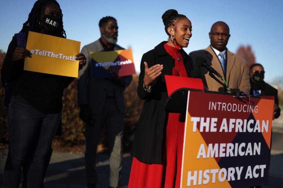 U.S. Rep. Shontel Brown (D-OH) speaks as Rep. Jamaal Bowman (D-NY) (2nd R) listens during a news conference in front of the U.S. Capitol December 14, 2021 in Washington, DC. (Photo by Alex Wong/Getty Images)