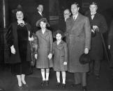 <p>The Queen, Princess Elizabeth, Princess Margaret, and King George VI pose for cameras at King's Cross station, before departing to Sandringham Estate for the Christmas holiday.</p>