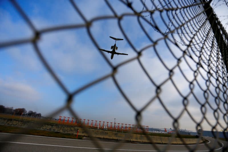 FILE PHOTO: An airplane prepares to land at Cointrin airport in Geneva