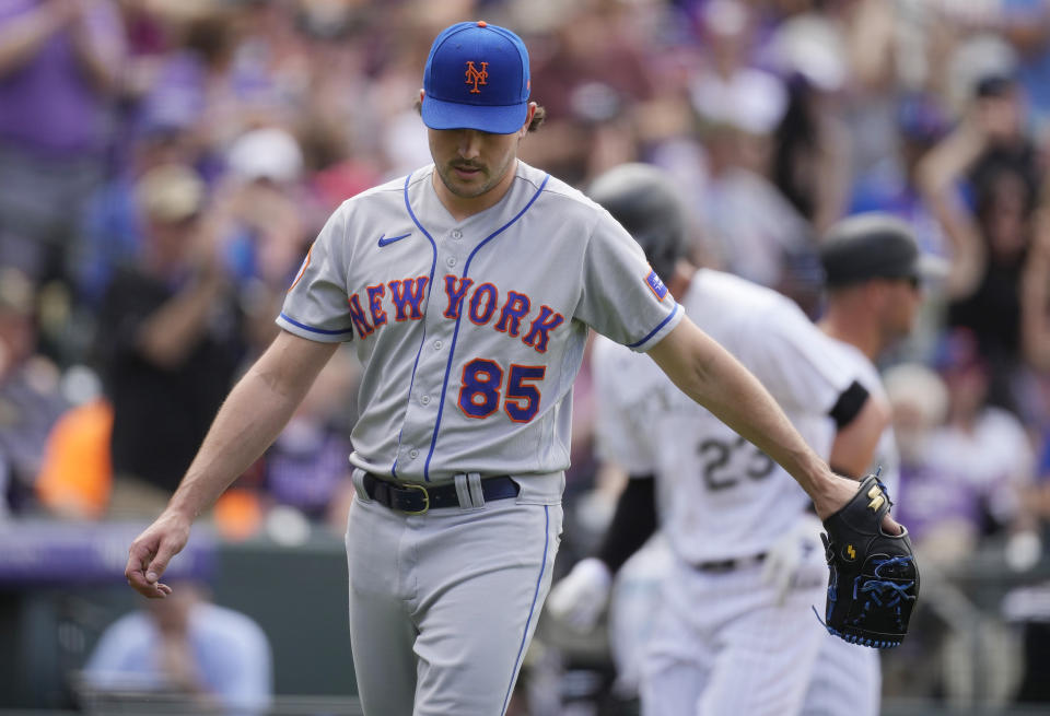 New York Mets relief pitcher Stephen Nogosek reacts after giving up a two-run home run to Colorado Rockies' Ryan McMahon in the fifth inning of a baseball game Sunday, May 28, 2023, in Denver. (AP Photo/David Zalubowski)